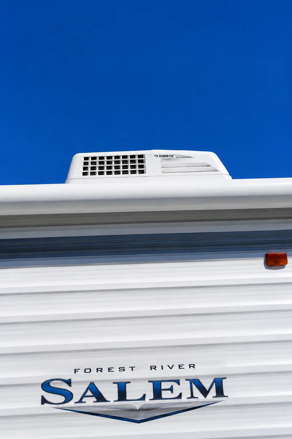 RV AC repair technician working on rooftop unit near Waterfront Park Louisville KY