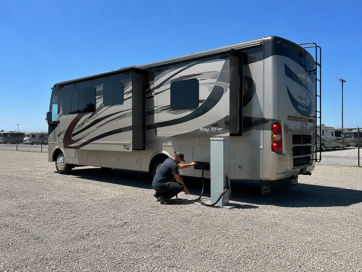RV electrical repair technician checking converter panel in Louisville KY